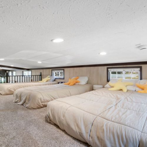 Loft area with three beds, perfect for additional guests.