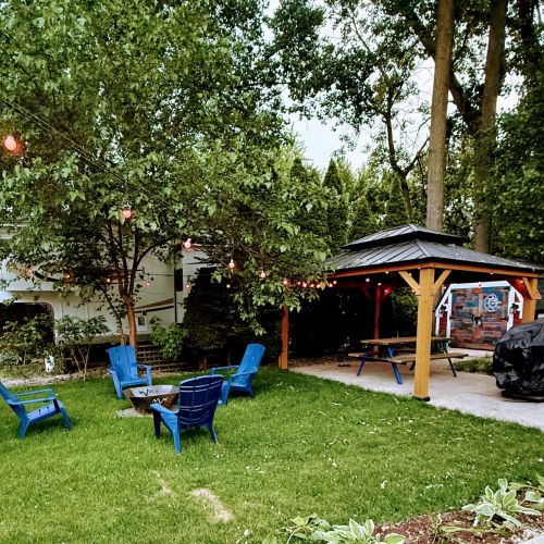 Cozy outdoor fire pit, perfect for evening gatherings, roasting marshmallows, or enjoying the campground ambiance.