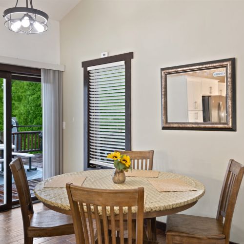 Dining room table with view onto the deck.