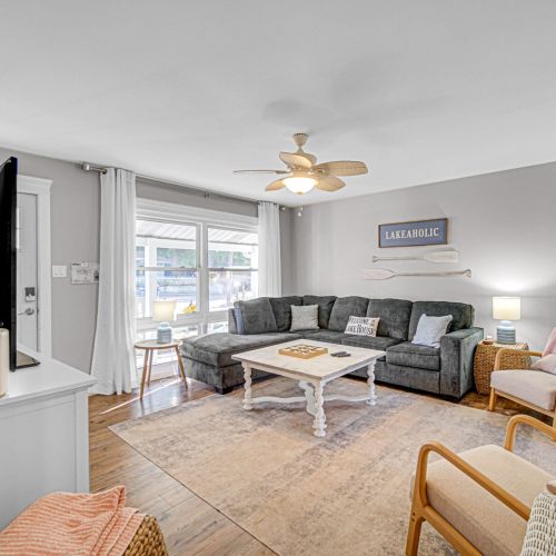 Open and airy living space with coastal-inspired decor, Smart TV, and plenty of room to relax after a day in the sun.