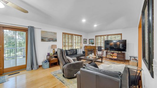 Cozy Living Room with Electric Fireplace, TV, and Family Games