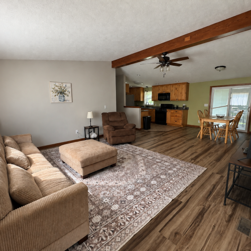 Comfortable living room with seating and a welcoming space to relax.