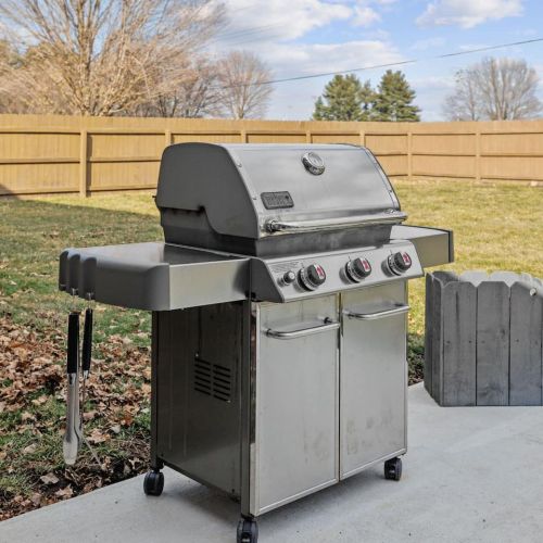 Back patio with seating for 4 and fire pit. Fenced in backyard with grill