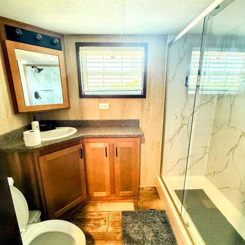 Modern bathroom featuring a walk-in shower.