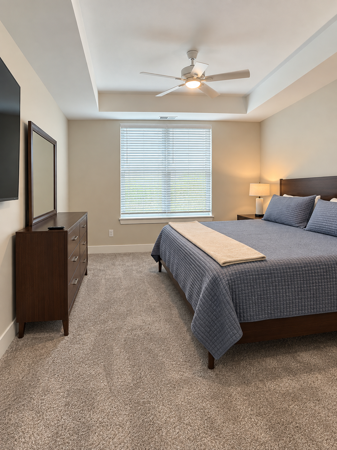 Bedroom with king bed and mirror