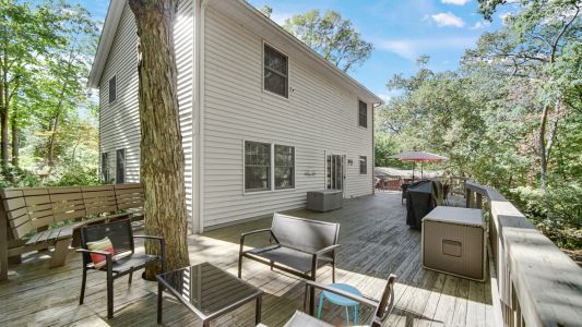 Large wraparound deck with grill and fire pit