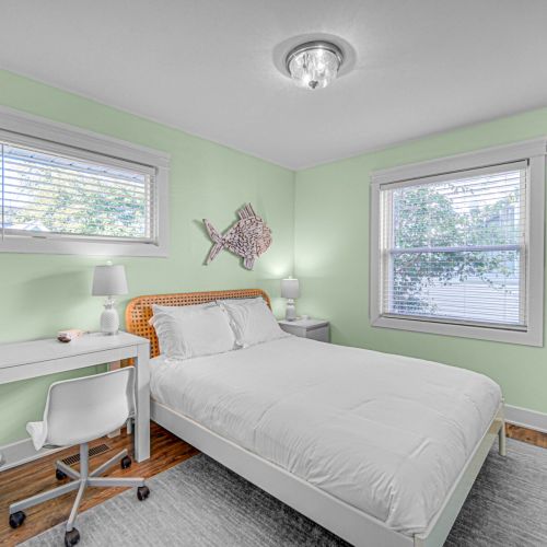 Guest Bedroom 2, with queen bed and desk.