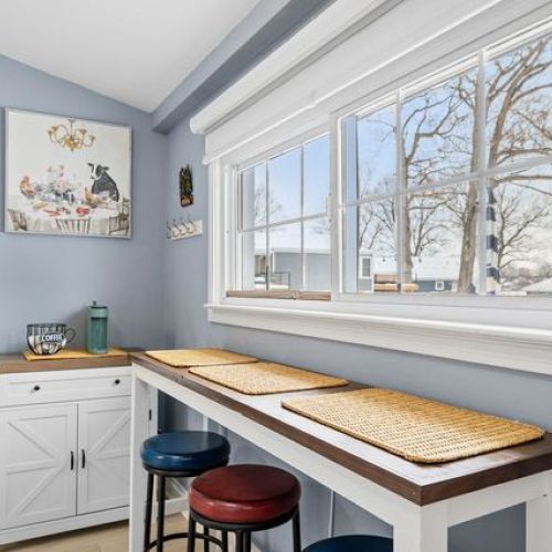 Breakfast bar with lake views and a glimpse of the exterior door.