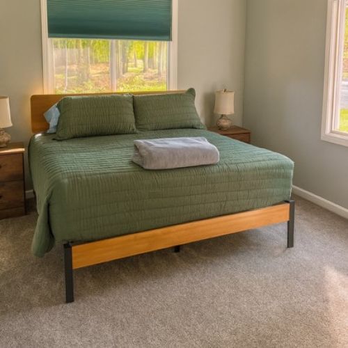 Bedroom with King Bed, 2 Side Tables with Lamps, Closet, Dresser & Smart TV