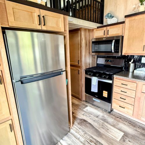 Funky Island - Well-appointed kitchen with a fridge and oven, making cooking easy and convenient.