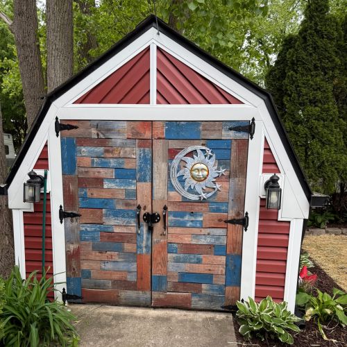 Front view of the shed doors, adding charm to the outdoor space.