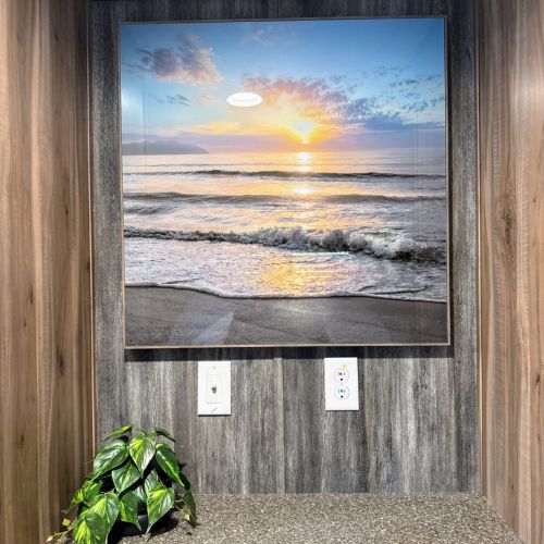 Beautiful beach painting, adding charm and character to the interior.