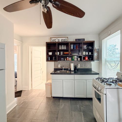 Upper Unit - Comfortable kitchen with basic amenities for preparing meals during your stay.