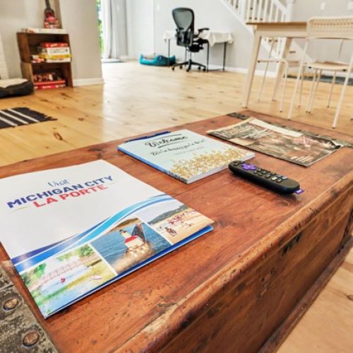 Coffee table with area recommendations and brochures.