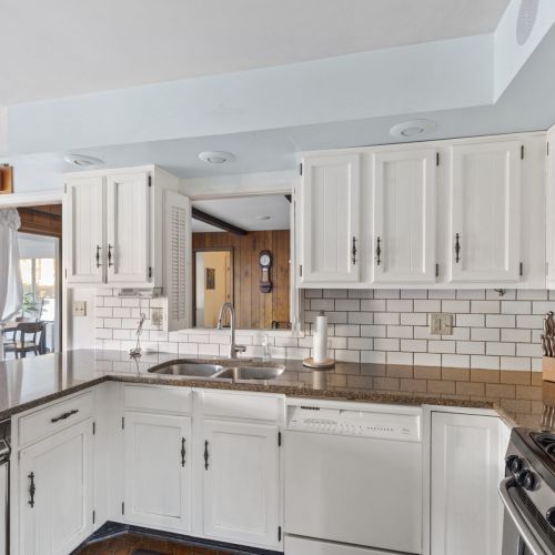 Functional kitchen with a pass-through above the sink, ideal for connecting spaces while cooking.