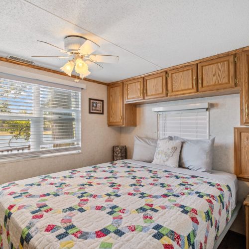 Relaxing bedroom with warm interiors and cozy furnishings, perfect for a restful stay.