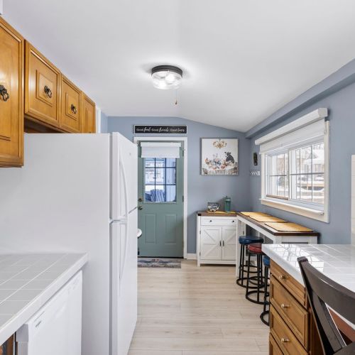 Kitchen view showing the door to the three-season room.