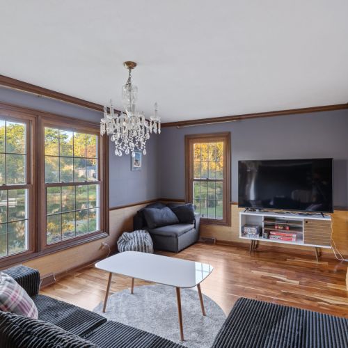 Willow on the Pond - Living room overlooking the water with a smart tv and board games.