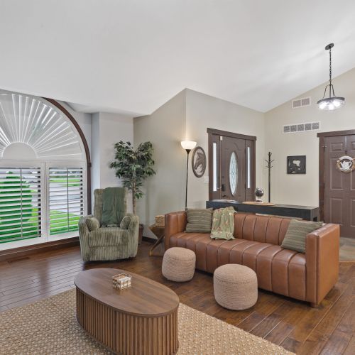 Spacious living room and view of the front door.