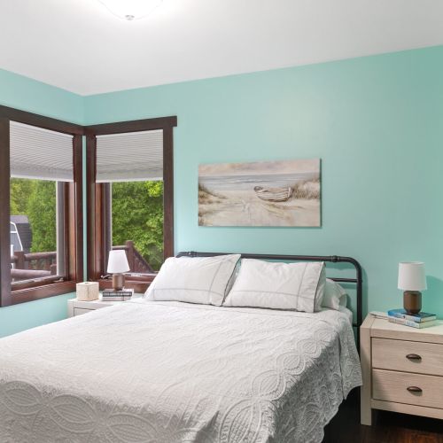 Bedroom 3 - Queen bed and windows overlooking the deck.