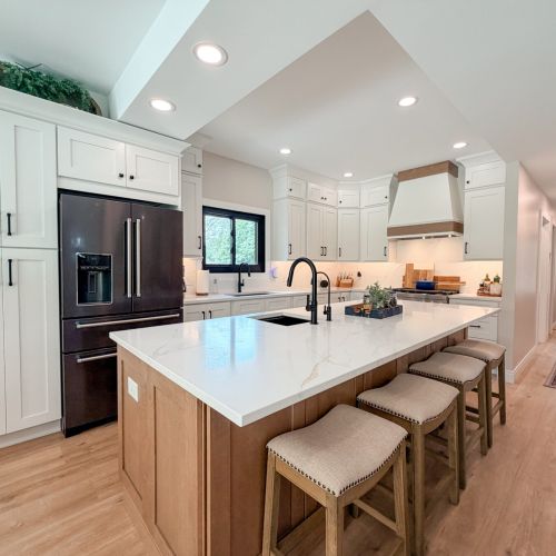 Fully equipped kitchen with an island and bar seating.