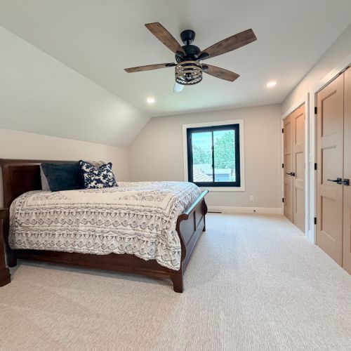 Comfortable bedroom 2 featuring a queen bed and cozy furnishings.