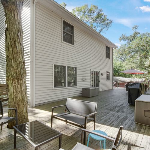 Large wraparound deck with grill and fire pit
