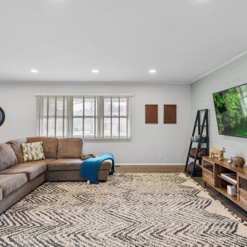 Sectional couch with tv, games, and a desk for working space. Beware of step down