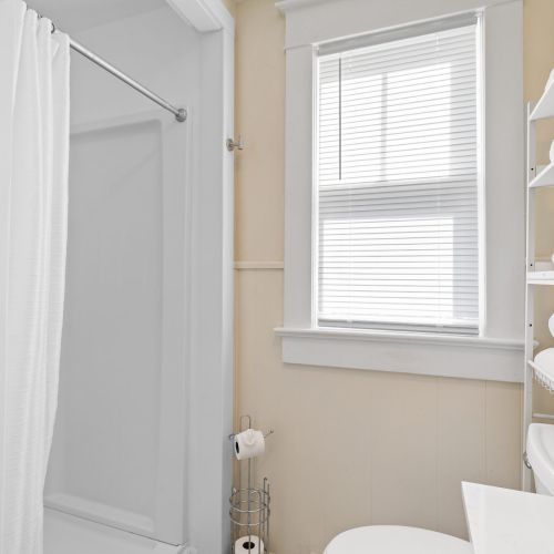 Bathroom 2 - View 2 
Bright full bathroom featuring a clean, relaxing space with updated fixtures and essentials provided.