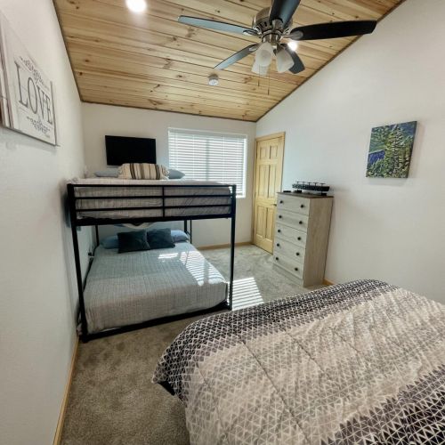 Upstairs Bedroom with Full Size Bunk Beds and a Queen Bed