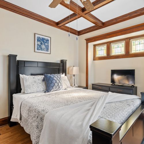 Bright, inviting bedroom with quality furnishings and a peaceful setting—perfect for both short and extended stays.