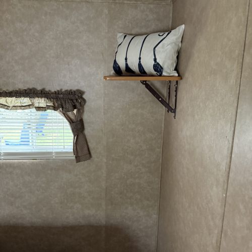 Another view of the themed pillow, highlighting the playful, magical décor throughout the trailer.