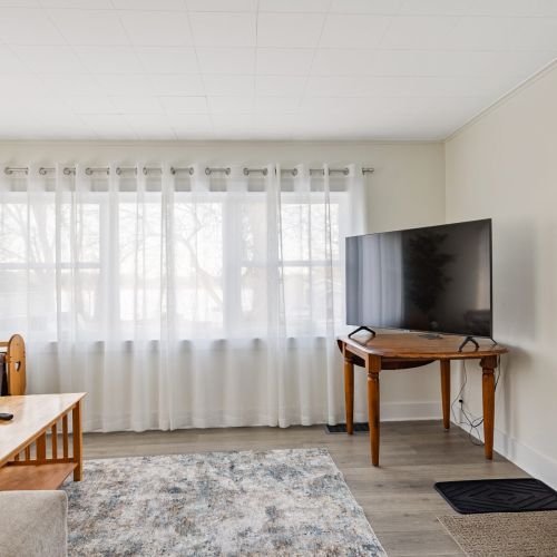 Large picture window with a Lake view.  Plenty of seating just off the dining room.