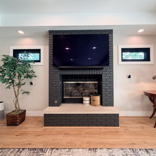 Cozy living room featuring a gas fireplace and Smart TV for relaxing evenings.