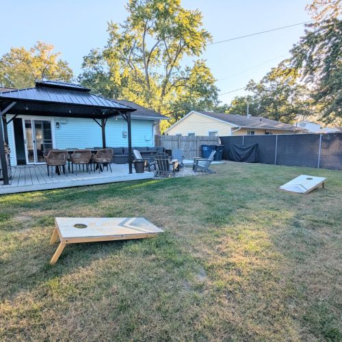 Enjoy friendly competition with tetherball and cornhole on the lush backyard lawn, fun for kids and adults alike!