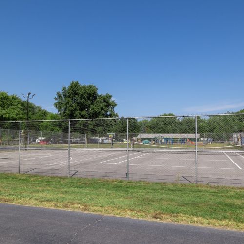 Tennis and basketball court offering outdoor fun and recreation for all ages.