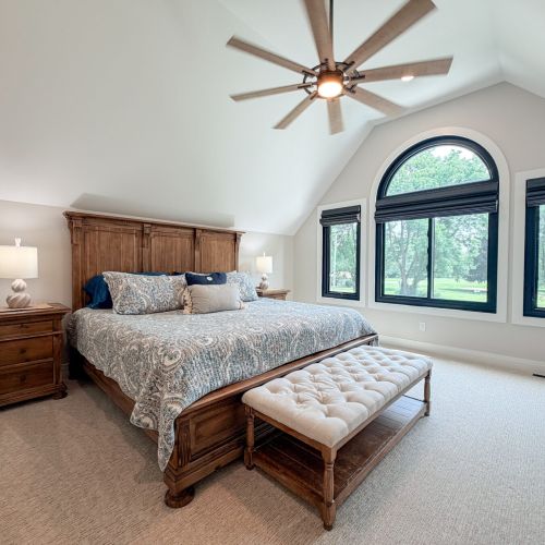 Spacious master bedroom featuring a comfortable king bed.