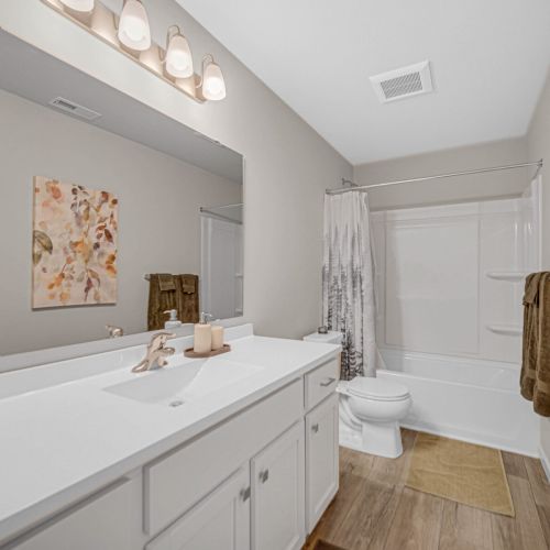 Full bathroom featuring a tub and shower with plenty of space.