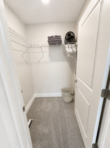 Walk in Closet with fan, hangers, laundry basket