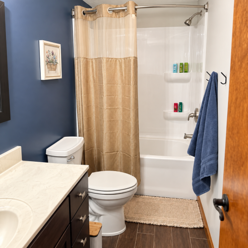 Additional view of the full bathroom, showcasing the tub and shower area.