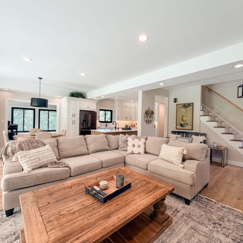Open-concept living area with seamless access to the dining room and fully equipped kitchen.