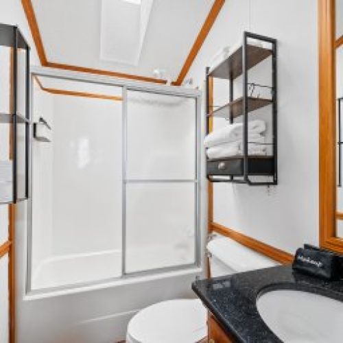 Clean and comfortable bathroom stocked with essentials.