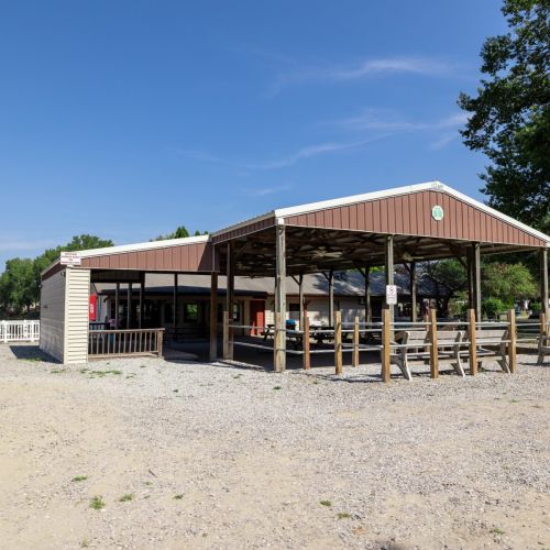 Enjoy the camp store and nearby picnic area with tables, perfect for casual outdoor dining.
