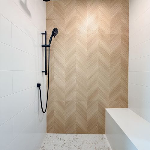 Spacious shower area with convenient features for everyday comfort.