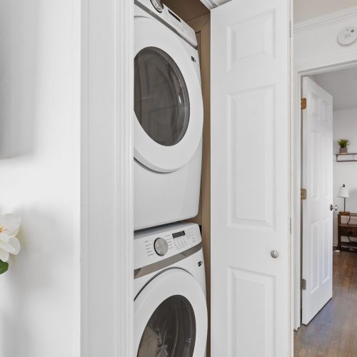 Stackable, Full Sized Washer and Dryer in Hall Closet
