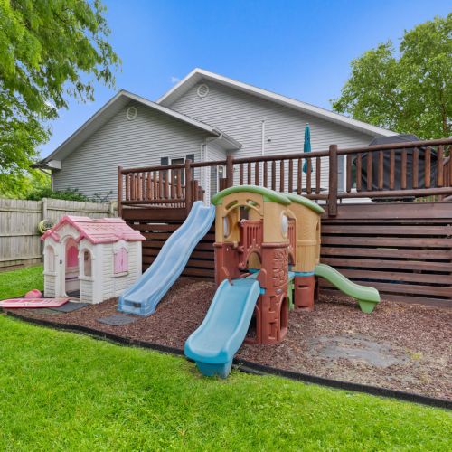 Kids play area in the fenced in back yard.