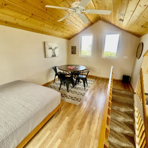 Loft with Queen bed, a portable closet & a table for 4