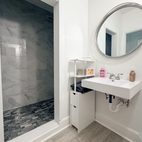 Bathroom with a stand-up shower for easy access.
