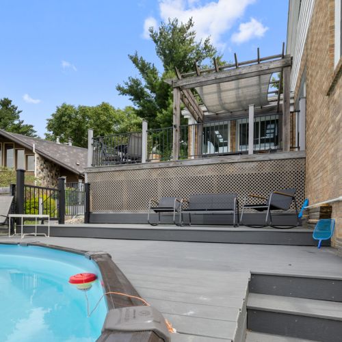 View of the deck area by the pool and the overlooking deck space.