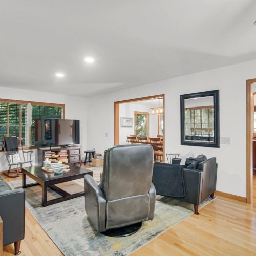 Cozy Living Room with Electric Fireplace, TV, and Family Games